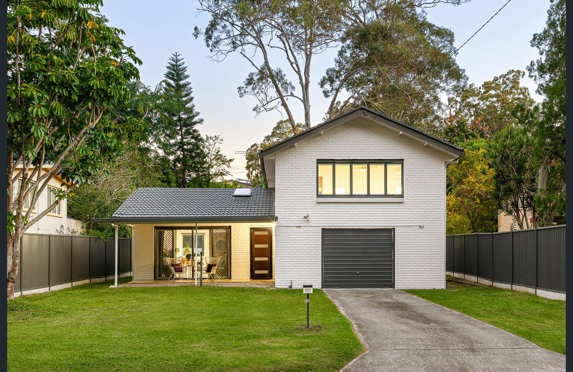 Restored Queenslander facade showcasing heritage paintwork