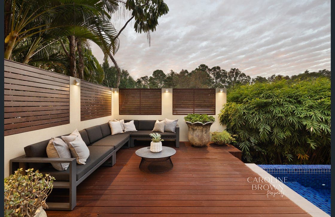Coated timber deck and outdoor lounge area at a Brisbane home